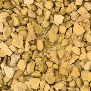 Close-up of 20mm Cotswold chippings showcasing natural cream and honey tones